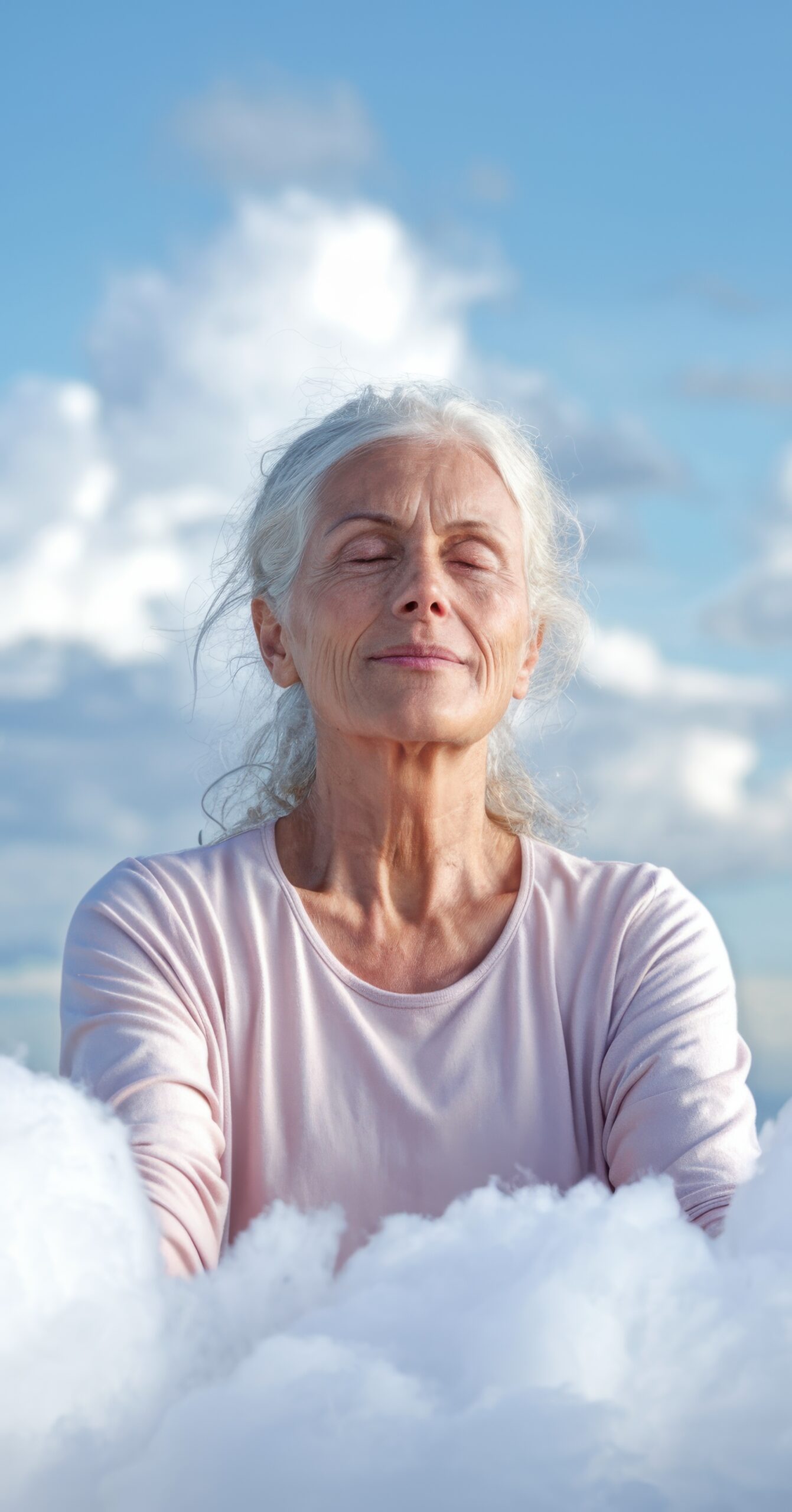 Serene Elderly Woman Meditating Among Clouds Under Blue Sky